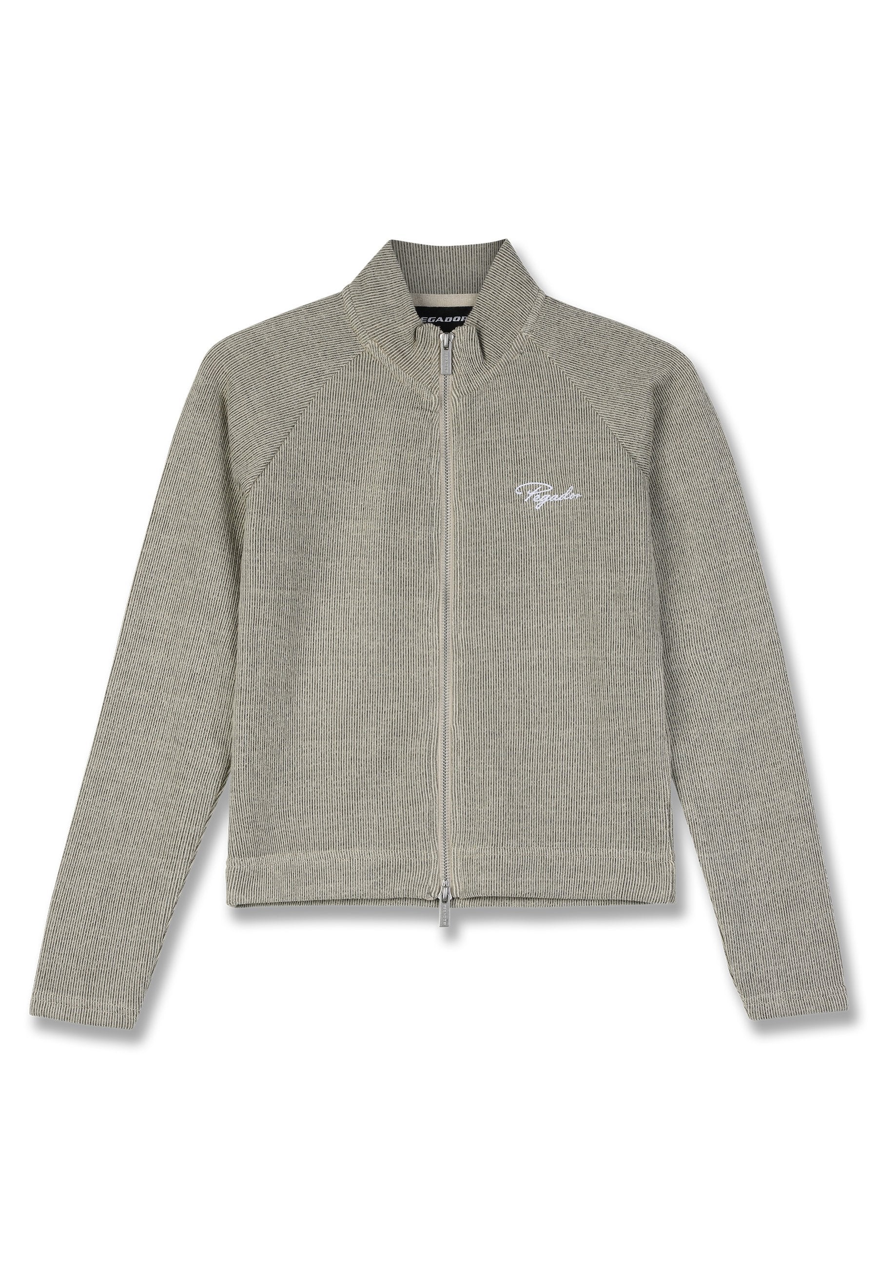 Helles graues Zip-Jacke aus geripptem Stoff. Verfügt über einen hohen Kragen, Raglanärmel und ein gesticktes Logo auf der Brust.
