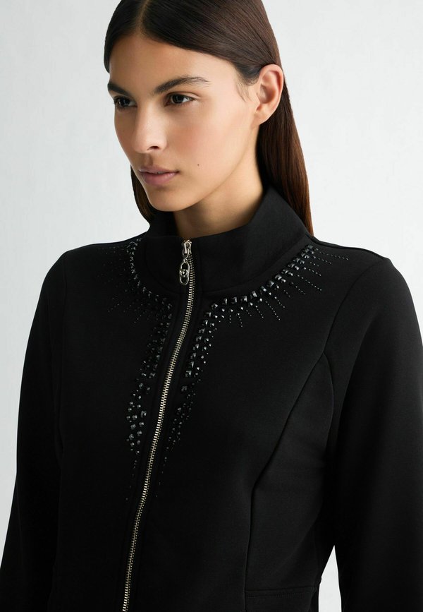 LIU JO WITH ZIP AND RHINESTONES
