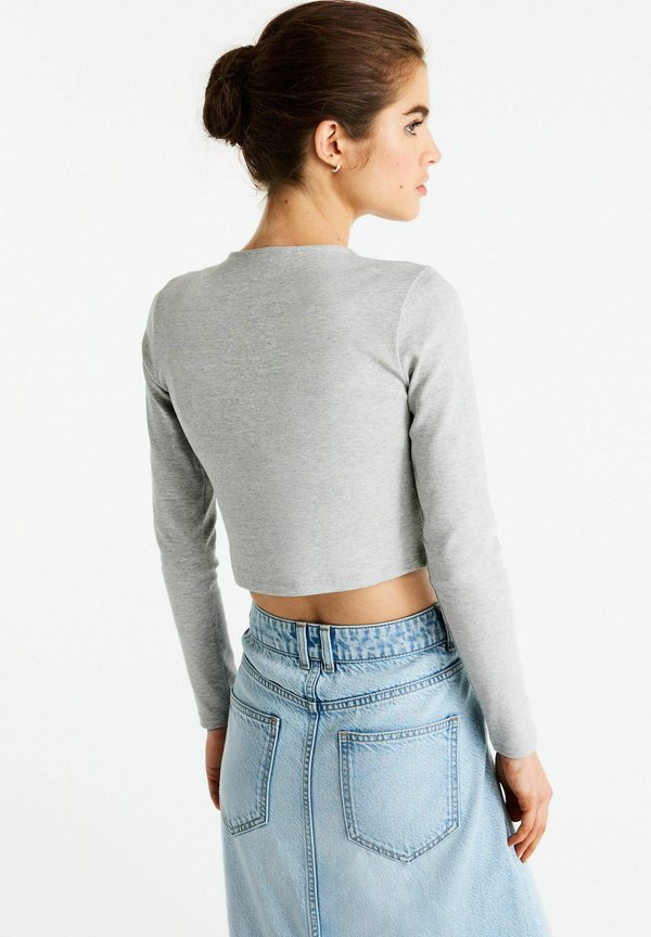 Next   CREW NECK