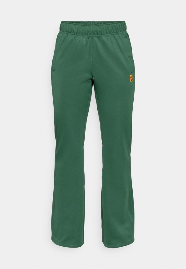 Nike Performance NIKECOURT PANT HERITAGE - Tracksuit bottoms - fir