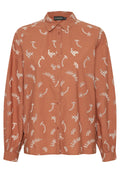Eisenorange Langarm-Bluse mit Knopfleiste und weißen gestickten abstrakten Blumenmustern sowie einem spitzen Kragen.