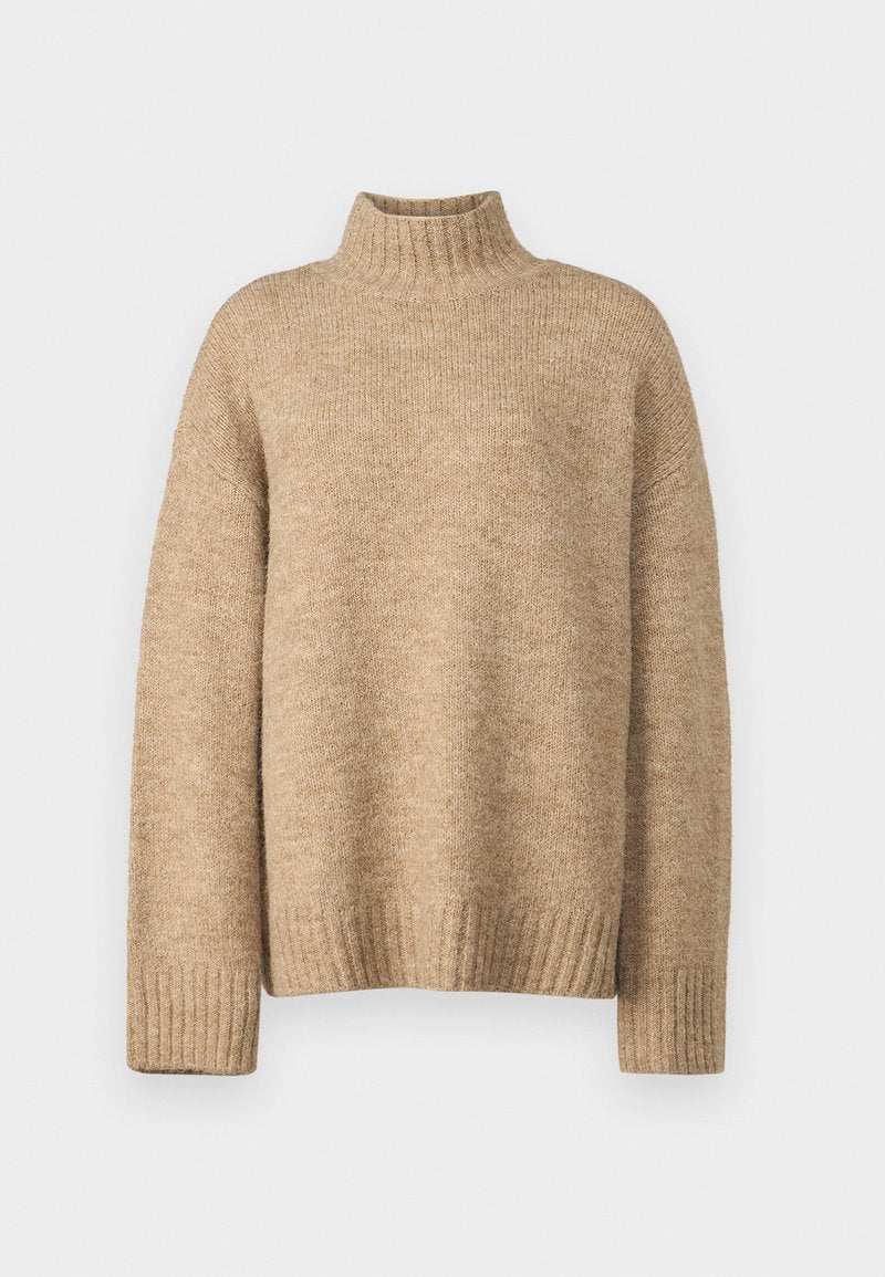 Beige Rollkragenpullover aus weichem, strukturiertem Strickmaterial. Verfügt über gerippte Bündchen und Saum sowie einen lockeren Sitz. Klassisches und gemütliches Design.