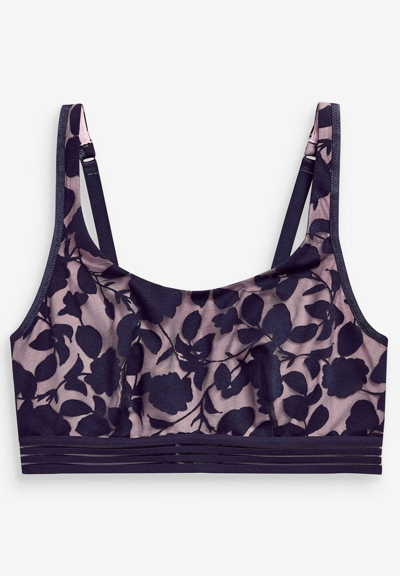 Navyblauer Floral-Spitzen-Bralette mit weichen Cups, verstellbaren Trägern und einem verstärkten Bande, das drei horizontale Streifen aufweist. Translucenter Stoff.