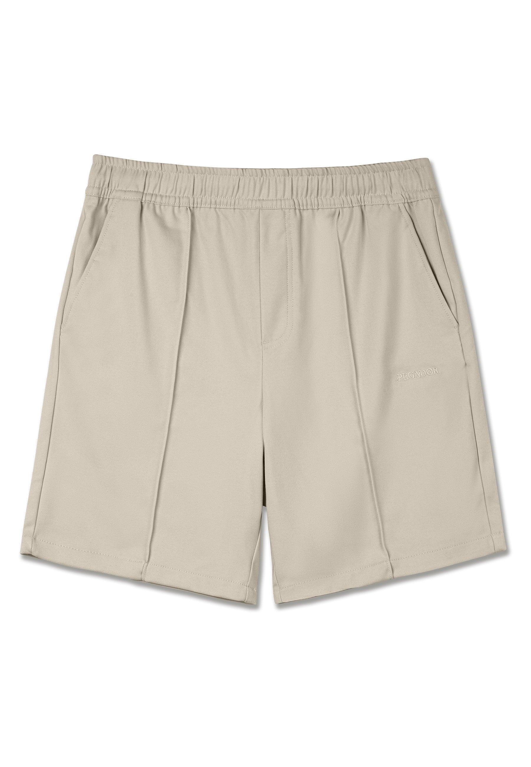 Beige Shorts aus einem glatten, leichten Stoff. Mit einem elastischen Bund und zwei Seitentaschen mit zarten Stichdetails.