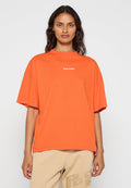 Übergrößenshirt in Orange aus Baumwolle, mit einem gerippten Rundhalsausschnitt und einem weißen "PEGADOR"-Logo auf der Brust. Glatte Textur.