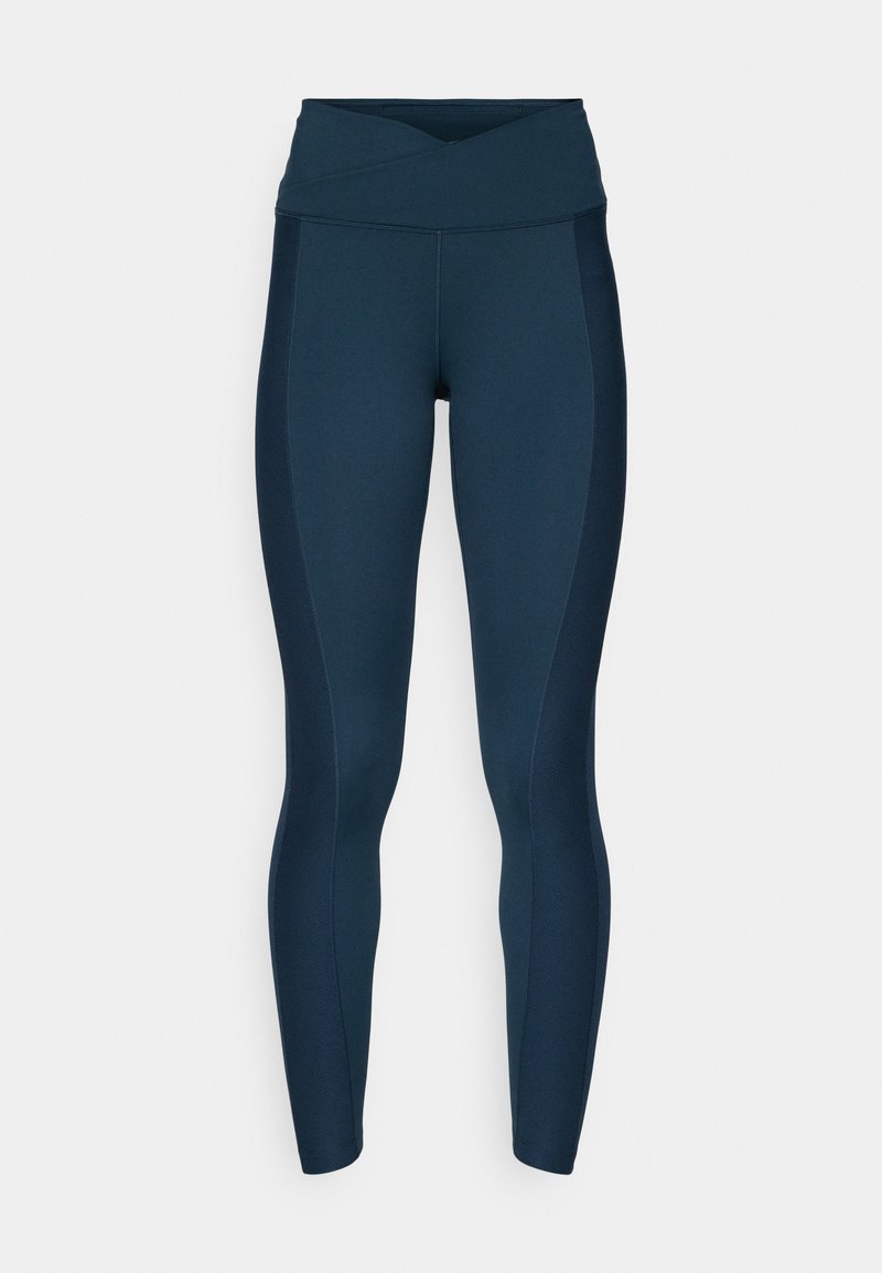 Marineblaue Leggings mit einem hohen Kreuzbund, glatter Textur und kontrastierenden Seitenpaneelen. Keine sichtbaren Muster oder Hardware-Details.