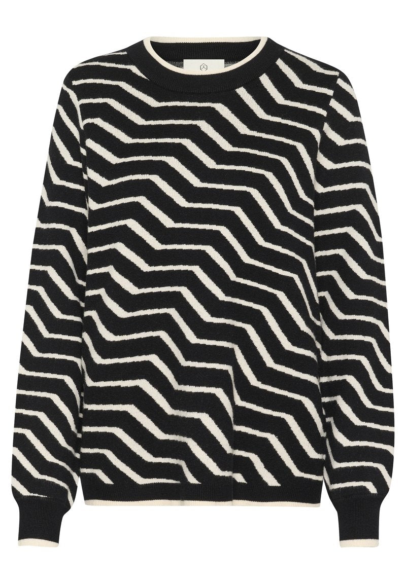 Strickpullover mit Zickzackmuster in Schwarz und Creme, runder Ausschnitt und gerippten Bündchen. Weiche Struktur mit lässiger Passform.