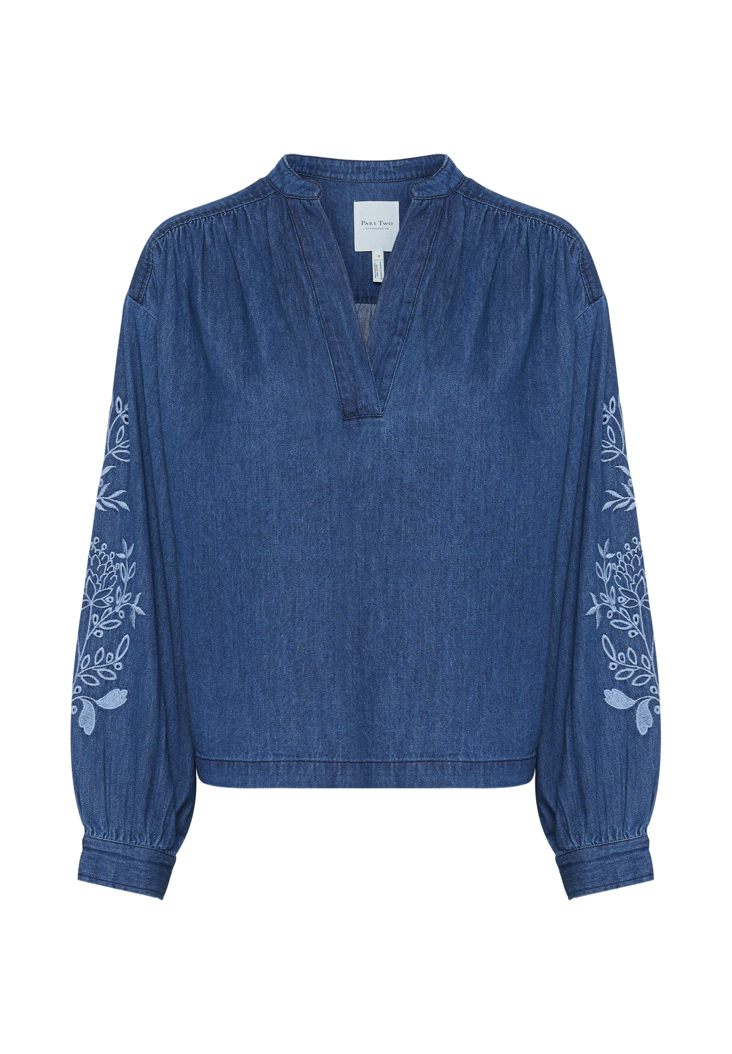Denimbluse mit V-Ausschnitt, langen Ballonärmeln und floralen Stickereidetails an den Ärmeln. Farbe: dunkelblau. Lässige Passform.