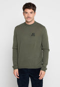 Olivgrüner Strickpulli mit Rundhalsausschnitt, langen Ärmeln und kleinem schwarzen Diesel-Logo auf der linken Brust. Weicher Stoff und taillierte Passform.