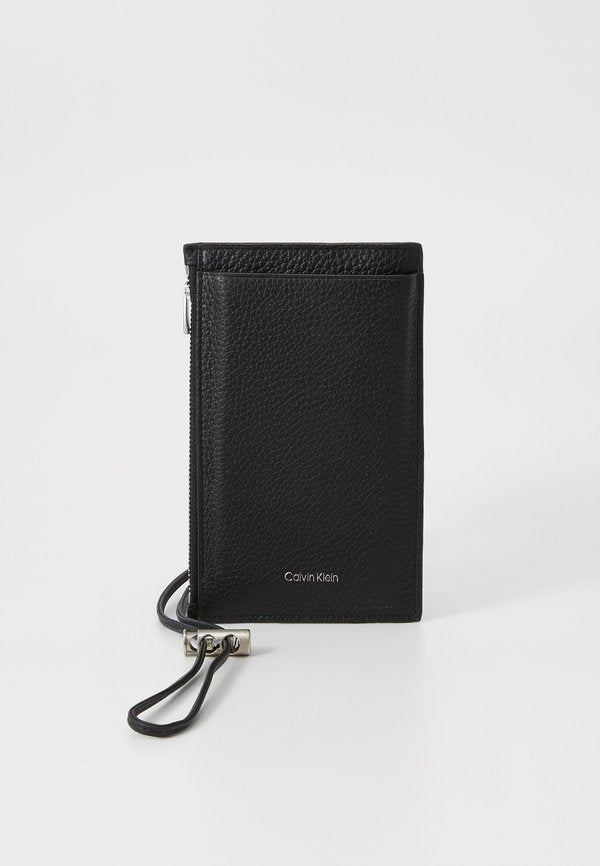 Calvin Klein EMBOSS PHONE CROSSBODY - Phone pouch - black