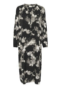 Schwarzes Blumenkleid mit langen Ärmeln, knopfleiste am Ausschnitt und legerem Schnitt. Mit weißen und grauen Blumenmustern auf softem Stoff.