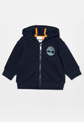 Marineblauer Reißverschluss-Hoodie mit einem Baum-Logo, orangen Akzenten, zwei frontalen Taschen sowie gerippten Bündchen und Saum. Hergestellt aus einem weichen, strukturierten Stoff.