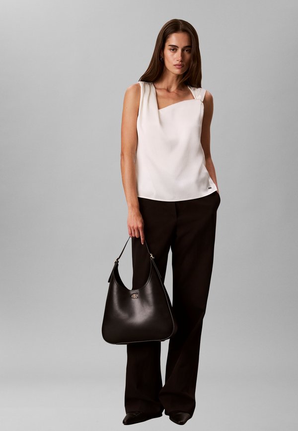 Calvin Klein EMBLEM DEBOSSED MEDIUM - Handbag - delicioso
