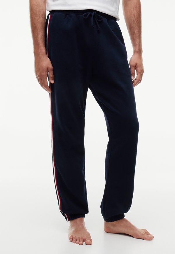 Tommy Hilfiger TRACK PANT - TH GLOBAL STRIPE LG - Pyjama bottoms - navy blue