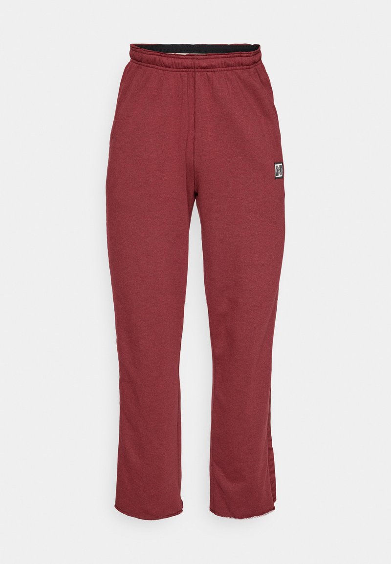 Bordeauxfarbene Sweatpants aus einer weichen Baumwollmischung, mit einem elastischen Bund, geraden Beinen und einem kleinen Logo-Patch an der Seite.