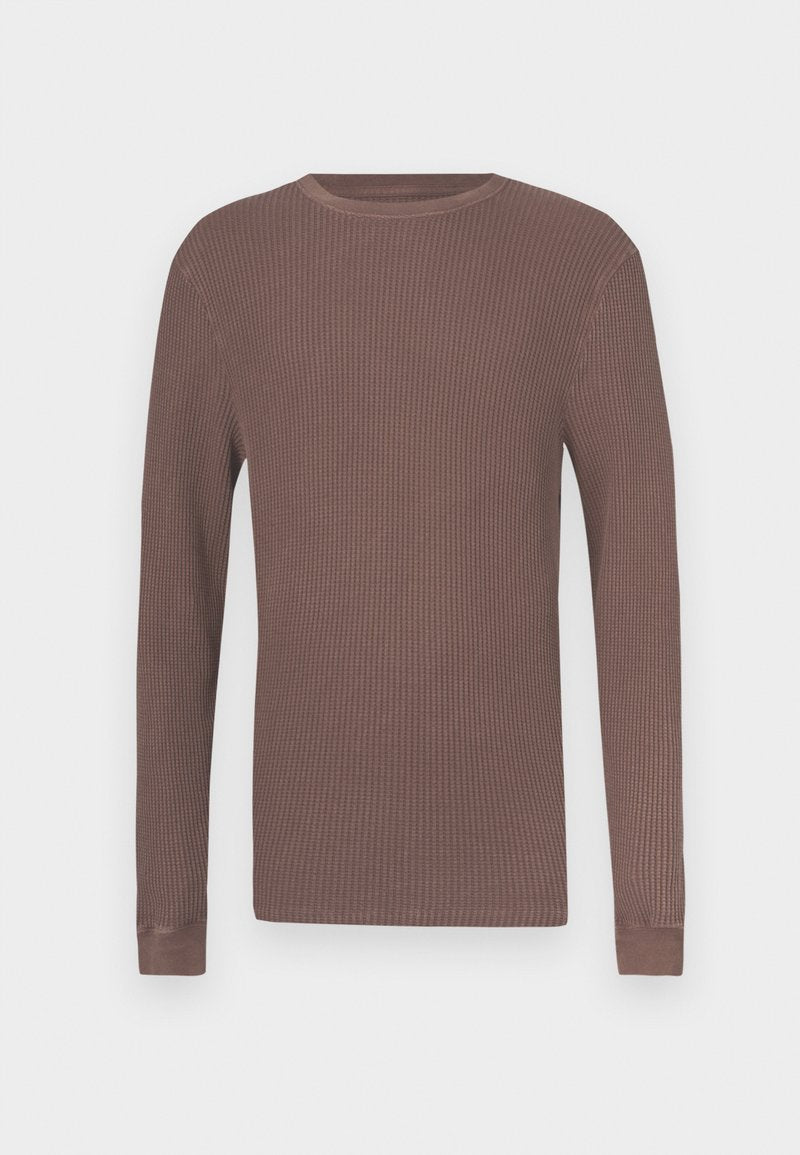 Langarmshirt aus braunem, geripptem Stoff mit Rundhalsausschnitt und eng anliegenden Bündchen. Hergestellt aus strukturiertem Gewebe für Komfort und Wärme.