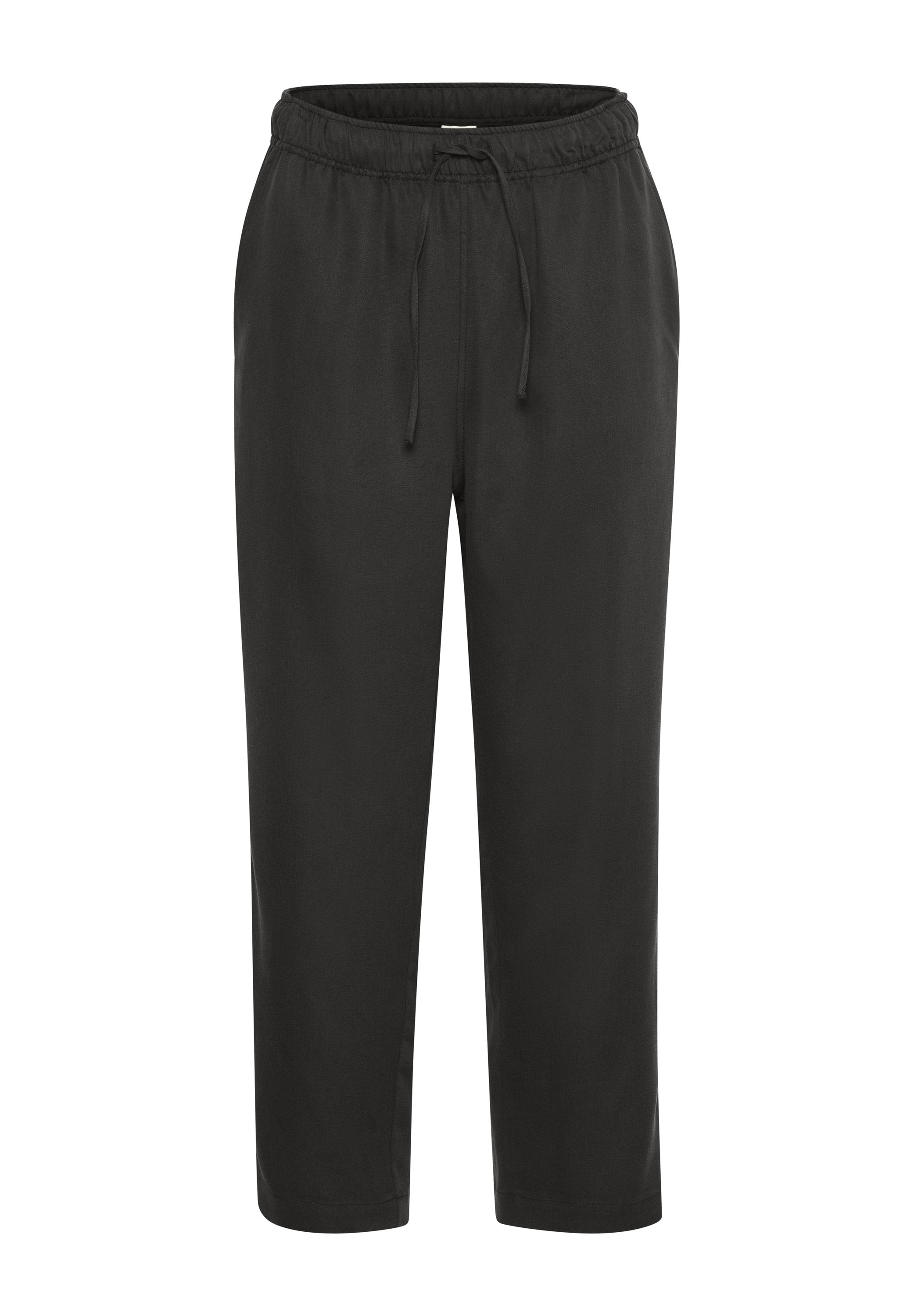 Schwarze, elastische Hosen mit einem Kordelzug. Hergestellt aus einem glatten, weichen Stoff. Knöchellang mit einer lässigen Passform und ohne sichtbare Muster.