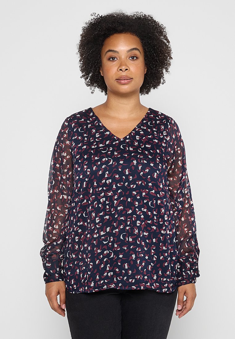 Dunkelmarinebluse mit V-Ausschnitt, transparenten langen Ärmeln und einem abstrakten Muster in Weiß, Rosa und Maroon. Leichter Stoff, lockere Passform.