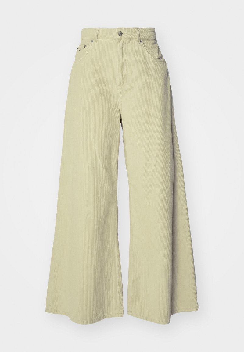 Weite corduroy-Hosen in Hellgrün, mit hoher Taille, zwei Fronttaschen, lockerer Passform und vertikaler Rippstruktur.