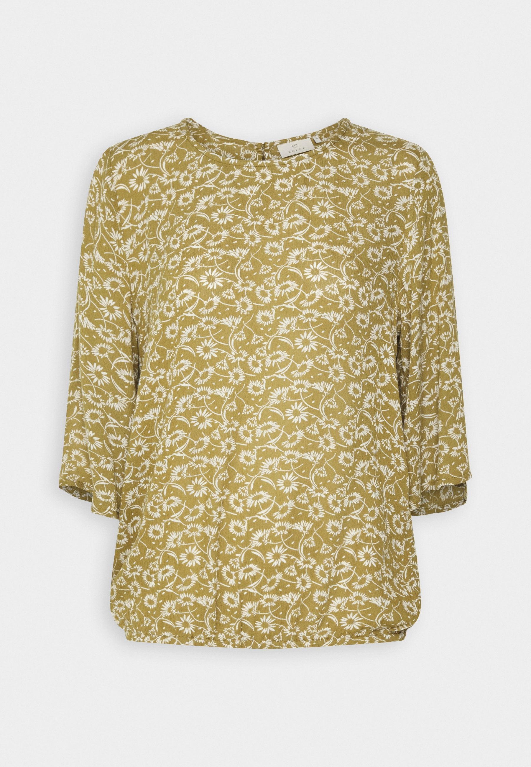 Senfgelbe Bluse mit weißem Blumenmuster, runder Ausschnitt, Dreiviertelärmel und lockerer Passform. Weicher, leichter Stoff.