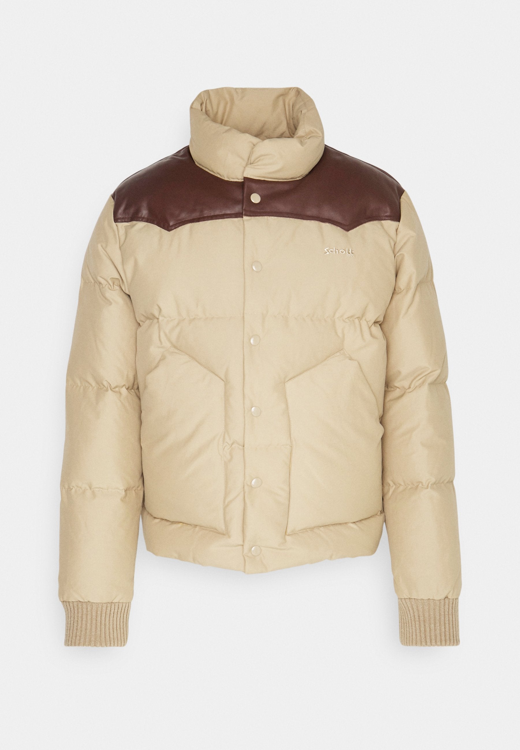 Beige Steppjacke mit braunen Leder-Schulterakzenten, Druckknöpfen, zwei Fronttaschen, gerippten Bündchen und hohem Kragen.