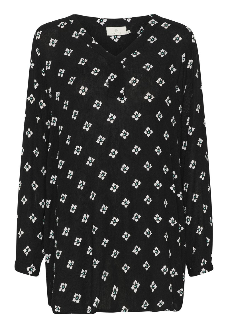 Schwarze Bluse mit V-Ausschnitt, langen Ärmeln und lockerer Passform. Mit einem weißen Blumenmuster und grünen Akzenten. Aus leichtem Stoff gefertigt.