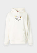 Beiger Kapuzenpullover mit Kängurutasche, verziert mit einem floralen Motiv und dem Schriftzug "Hugo" in Kursivschrift, gefertigt aus weichem Stoff.