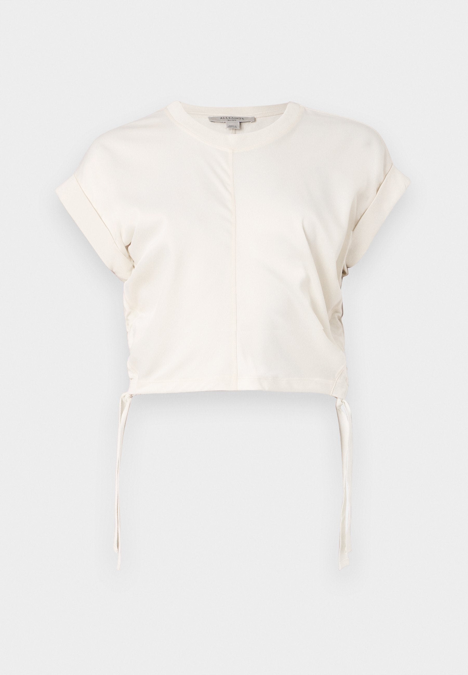 Cremefarbene Cropped-Top aus glattem Stoff, mit rundem Ausschnitt, kurzen Ärmeln und verstellbaren Seitenbändern. Einfaches, klares Design.