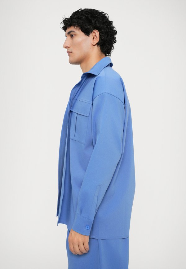 Essential Collective DOUBLE POCKET SHIRT