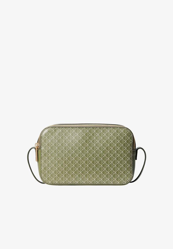 Calvin Klein EMBLEM AOP ELONGATED CAMERA BAG - Cross body bag - olivine aop