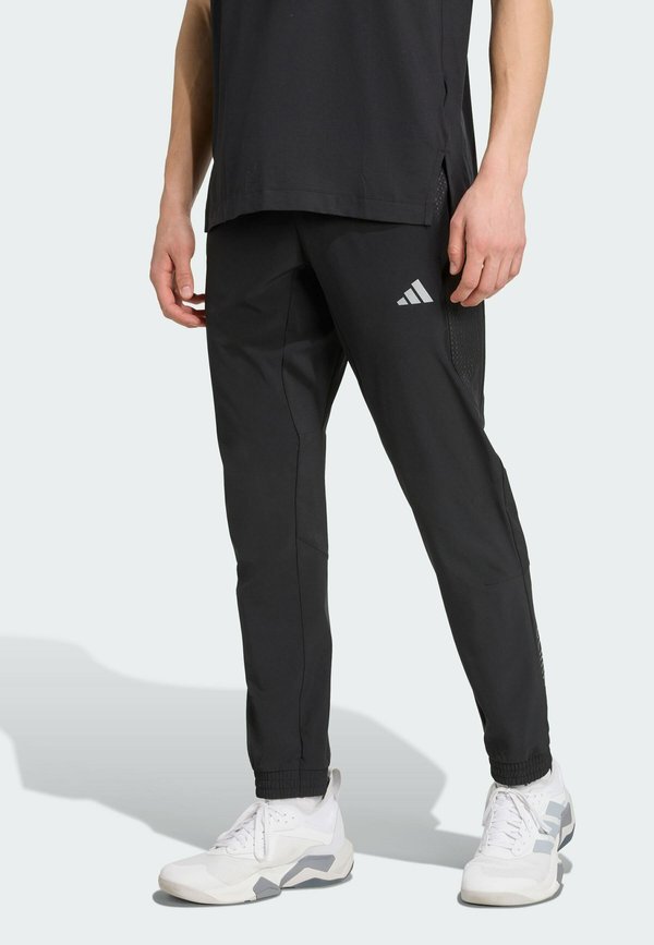 adidas Performance TECH APP - Tracksuit bottoms - black   carbon