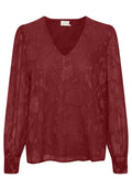 Rote transparente Bluse mit langen Ärmeln, V-Ausschnitt und floral gesticktem Muster. Die Bündchen sind mit einem elastischen Detail für eine engere Passform ausgestattet.