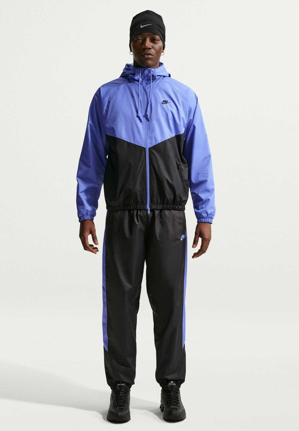 Nike Sportswear M NK WR LND PANT 26 - Tracksuit bottoms - black sapphire sapphire