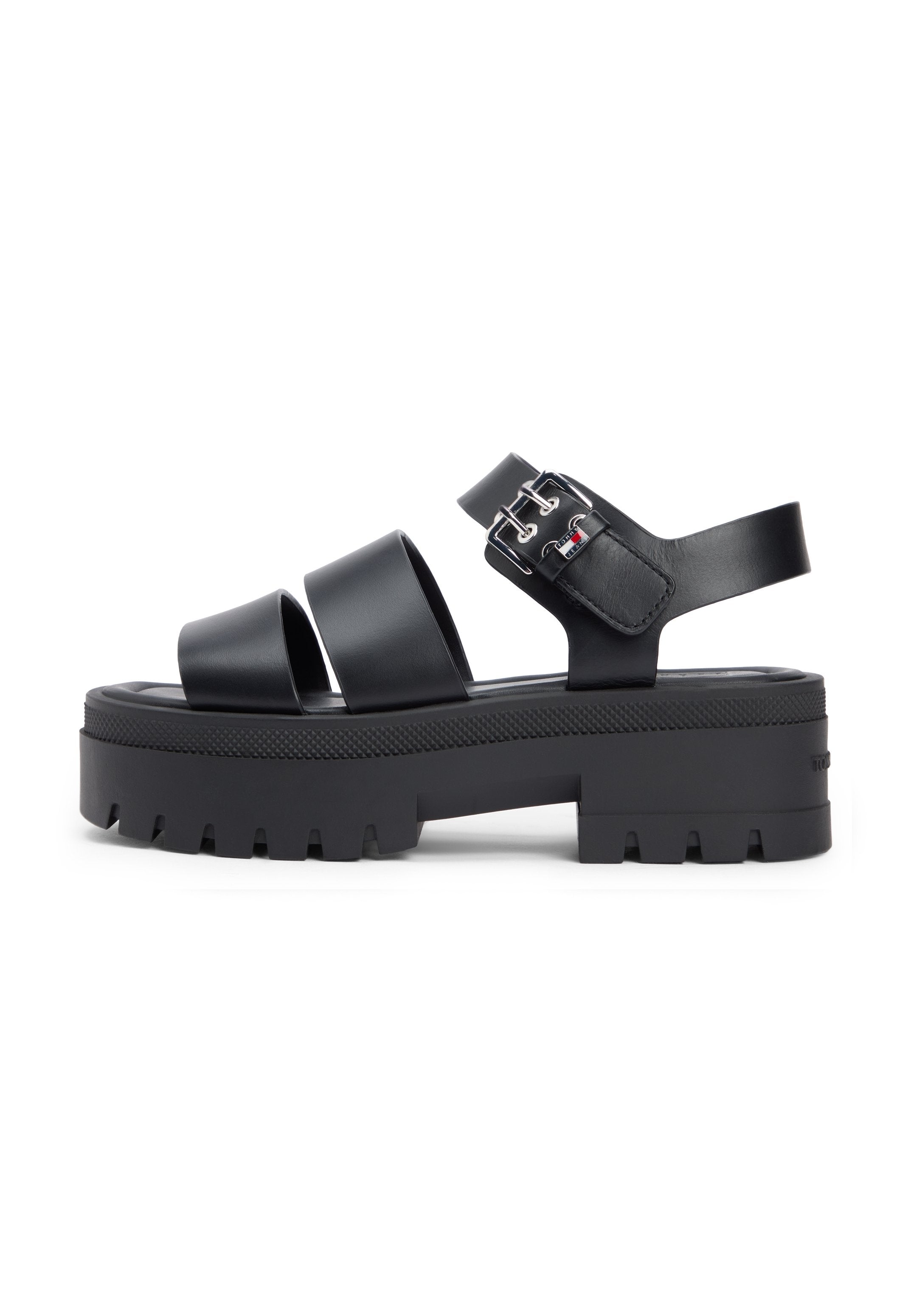 Schwarze Plateau-Sandalen mit drei breiten Riemen, einem verstellbaren Knöchelriemen und einer strukturierten Sohle mit Zickzackmuster.