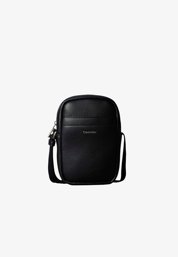 Calvin Klein RAISED SLIM REPORTER - Cross body bag - black