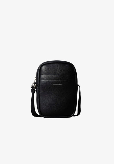 Calvin Klein RAISED SLIM REPORTER - Cross body bag - black