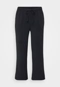 Schwarze Jogginghosen aus weichem Material, mit elastischem Bund und Kordelzug, seitlichen Taschen und geradem Bein. 