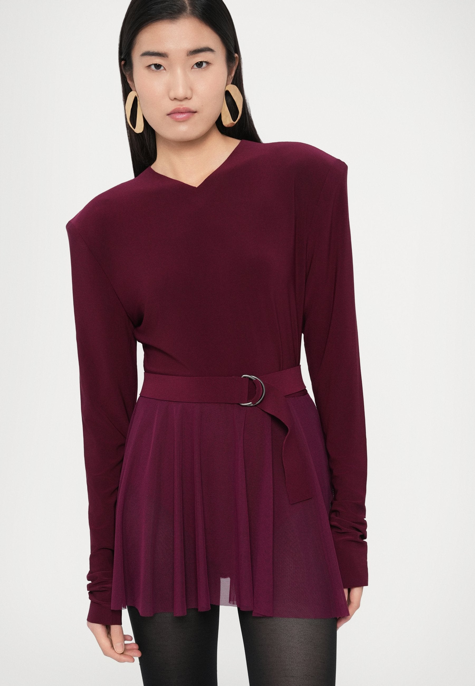 Norma Kamali LONG SLEEVE SHOULDER PAD V NECK FLARED PICKLEBALL