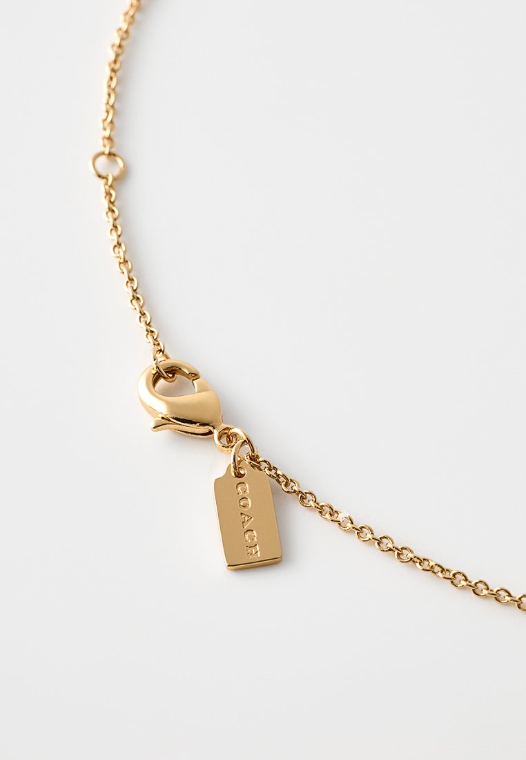 COACH CURSIVE SCRIPT SHORT PENDANT