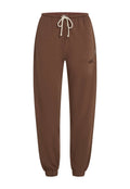 Braune Sweatpants aus weichem Material, mit einem elastischen Taillenbund und Kordelzug, schmal zulaufenden Beinen und einem Logoakzent an der Seite.