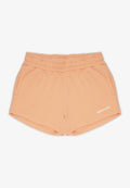 Pfirsichfarbene Shorts aus weichem Stoff mit einem elastischen Bund, seitlichen Taschen und einem kleinen weißen "PEGADOR"-Logo auf der Vorderseite.