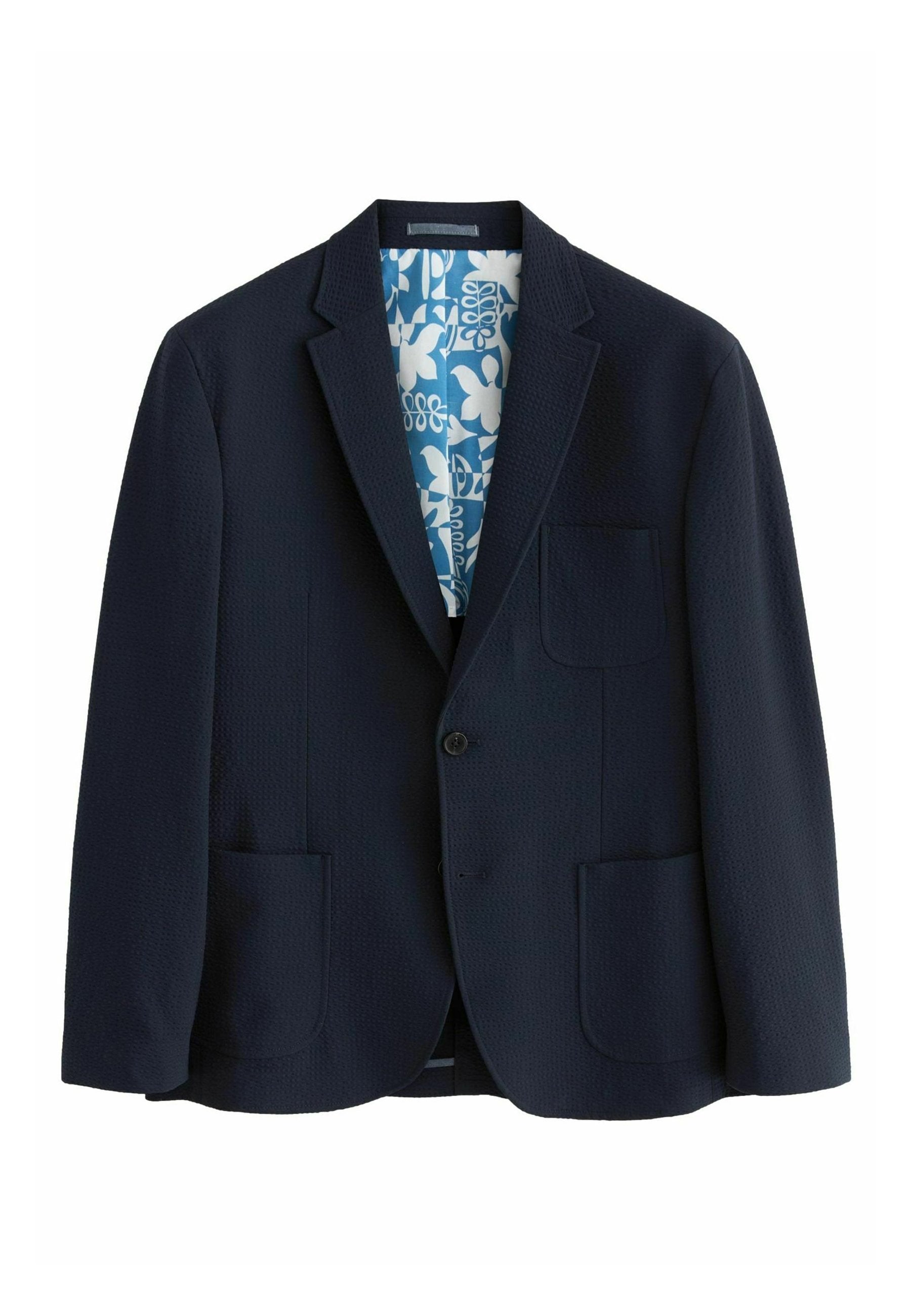 Marineblazer aus strukturiertem Stoff, mit Reverskragen, einem Ein-Knopf-Verschluss und zwei Vordertaschen; Innenfutter mit blauem Blumenmuster.