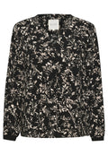 Schwarze Bluse mit langen Ärmeln, die ein florales Muster in Cremetönen zeigt, mit einem runden Ausschnitt und einer weichen Stofftextur.