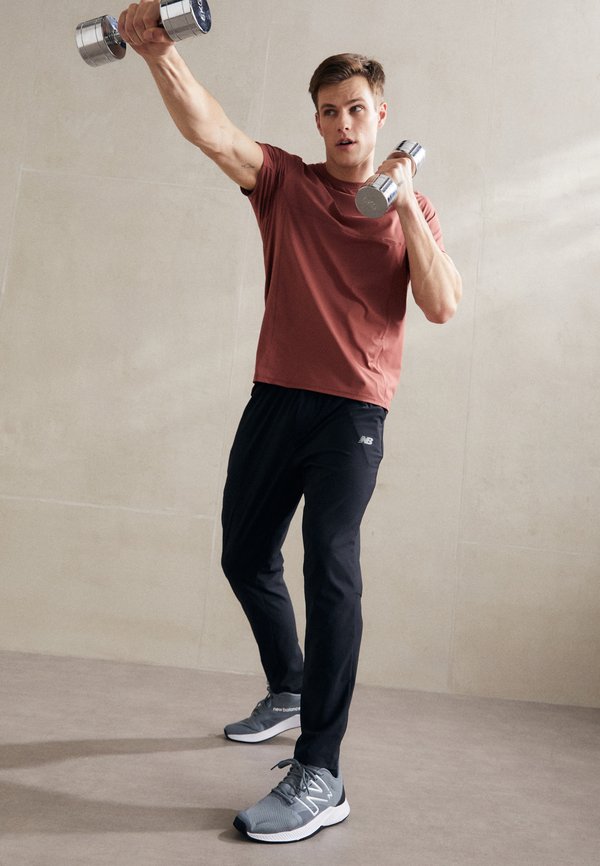 New Balance AC STRETCH REGULAR - Tracksuit bottoms - black