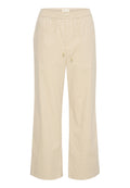 Beige weite Hose mit elastischem Bund, verstellbarem Kordelzug und goldenen Hardware-Details. Aus weichem, leichtem Stoff gefertigt.