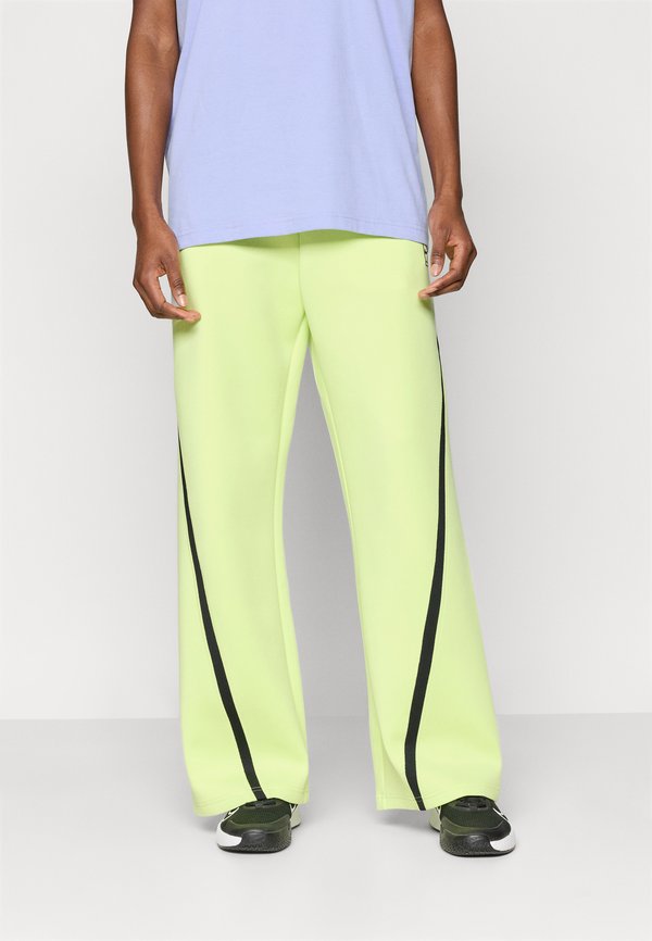 Nike Performance NIKECOURT ADVANTAGE - Tracksuit bottoms - lemon twist/black