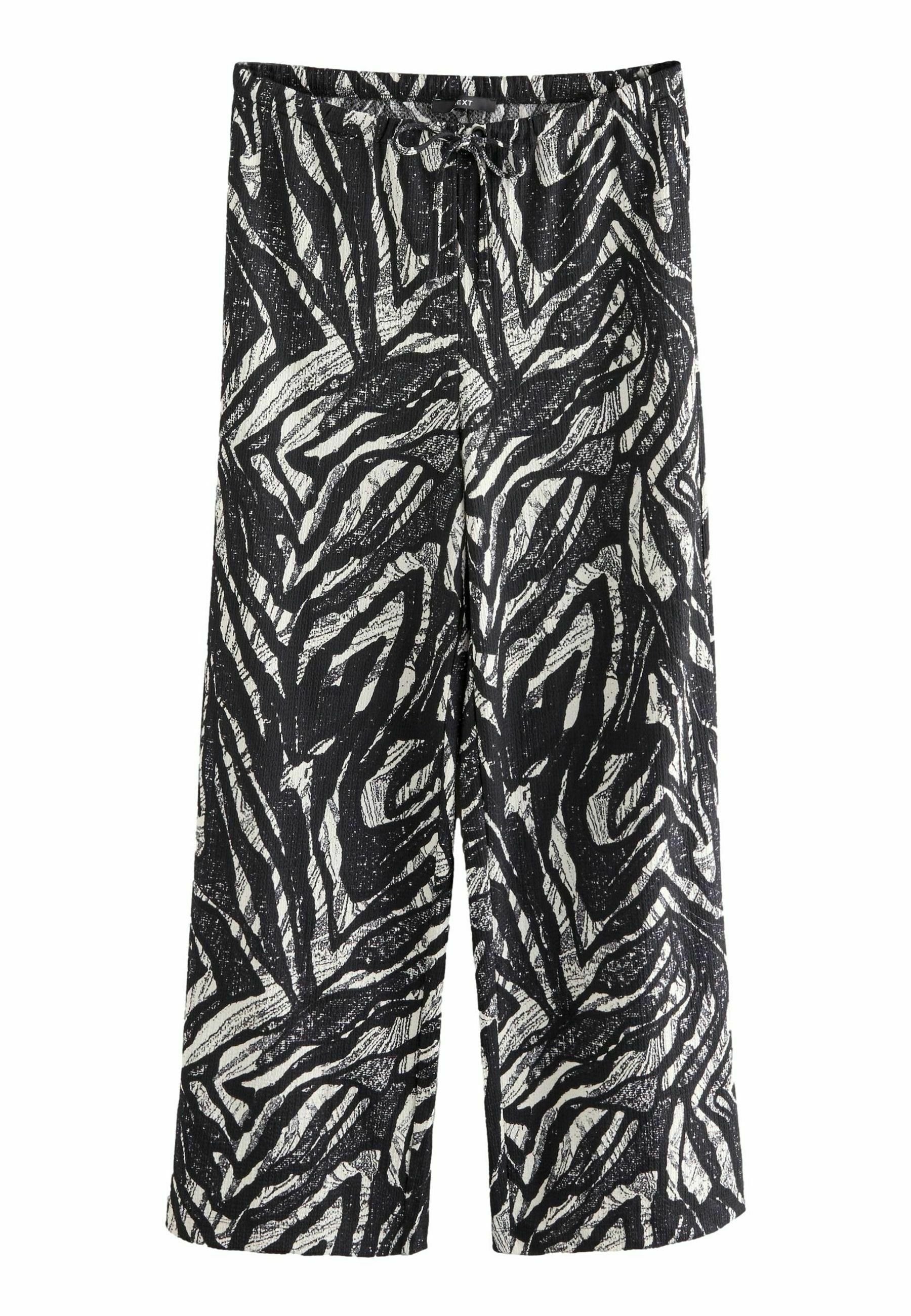Schwarz-weiß gestreifte weite Hosen mit einem Zebramuster, aus strukturiertem Stoff gefertigt, mit einem elastischen Bund und Zugband.