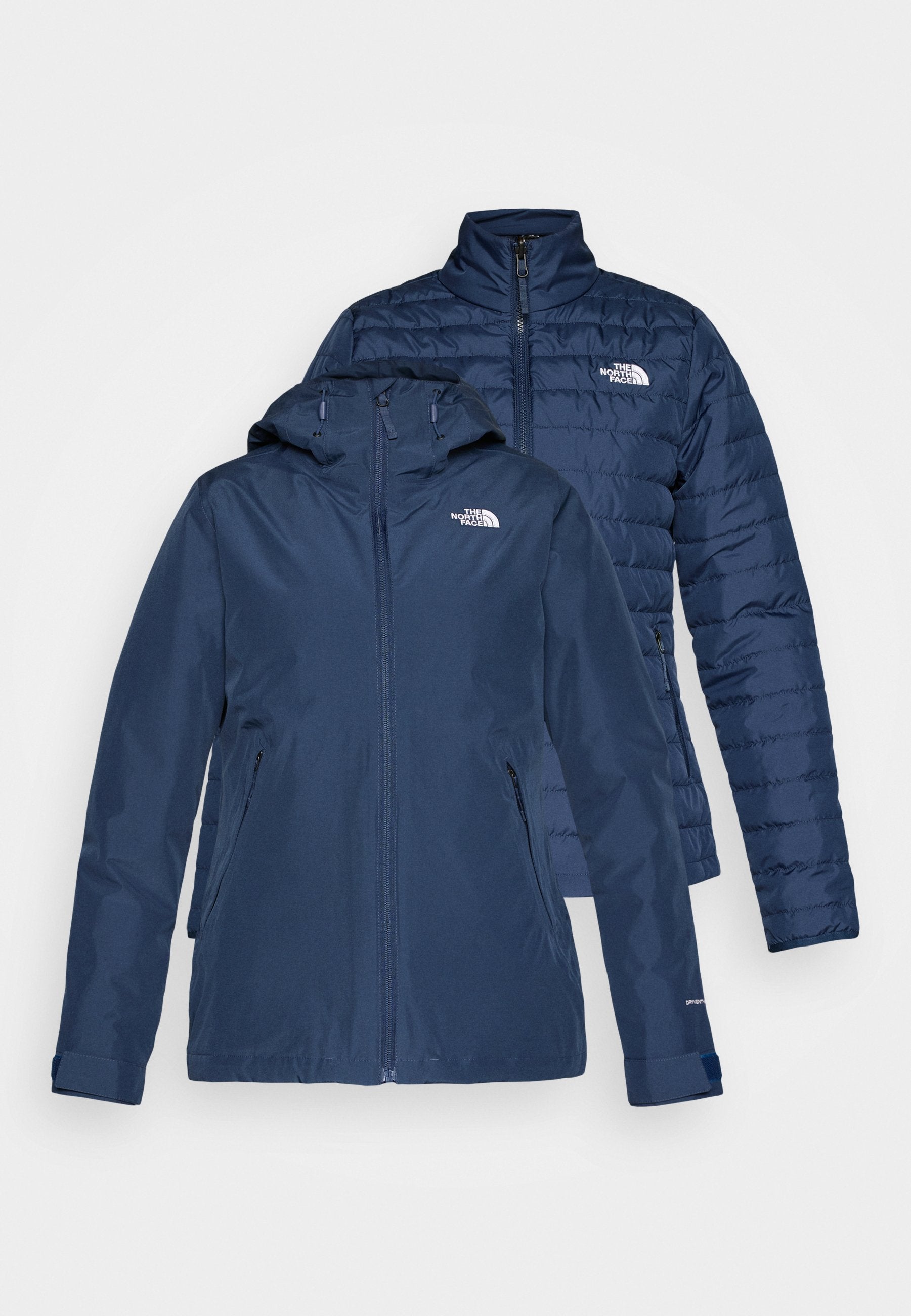 Marineblaue isolierte Jacke mit Kapuze und Reißverschluss. Verfügt über eine gesteppten Textur, seitliche Taschen und ein Logo auf der Brust. Wendbares Design.