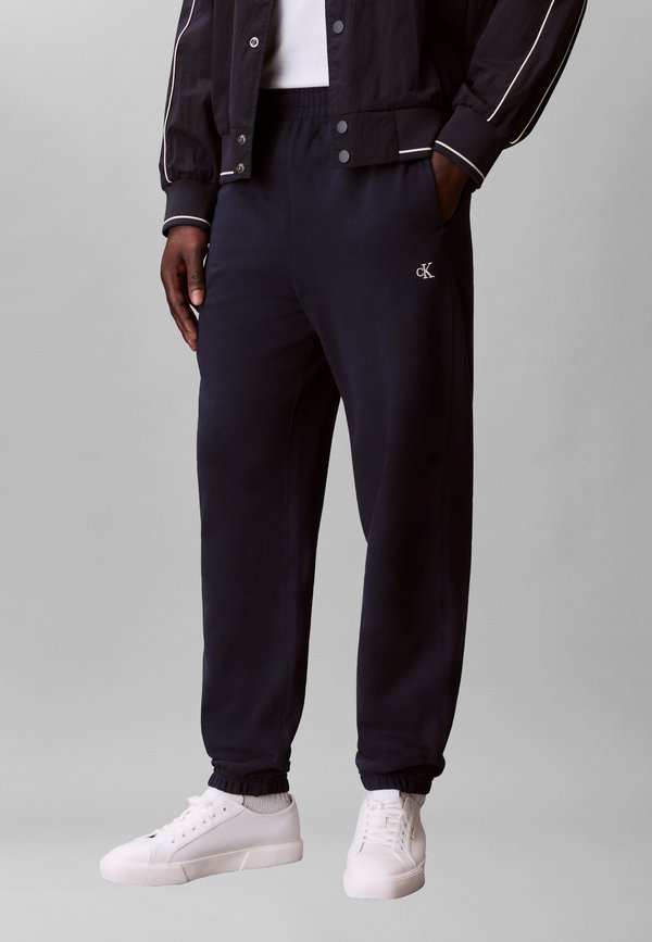 Calvin Klein Jeans MONOGRAM JOGGER - Tracksuit bottoms - dark sapphire