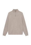 Beige gerippter Pullover mit hohem Kragen und halber Reißverschluss. Aus weichem Material gefertigt, mit langen Ärmeln und lockerer Passform.